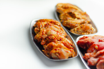 Three different set of the chicken wings with sriracha glaze, Caribbean marinade and Chinese glaze