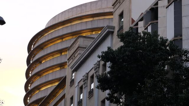 Dusk scene in central Barcelona with modern and traditional architecture - low anglew view 4K UHD