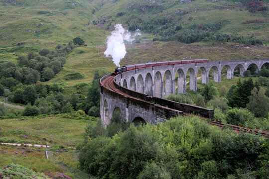 A view of the Glenfinnan Viaduct with a steam train going over © Simon Edge