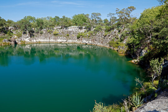 Scenic view of lake Otjikoto - a permanent sinkhole lake near Tsumeb in Northern Namibia .