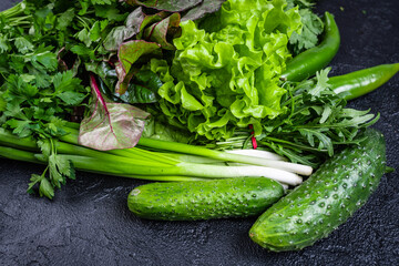 Fresh organic homegrown herbs and leaf vegetables background