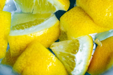 water with lemon slice. Fresh lemon in water