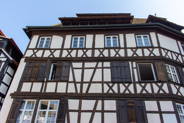 Close upward exterior view of traditional German timber-framed building architecture in Strasbourg, France