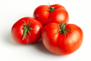 Three large ripe red tomatoes on a light background