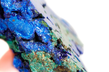 Macro mineral stone malachite with azurite on white background