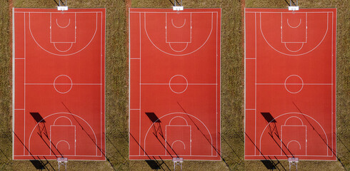 Drone view of three basketball court from above. Outdoor field activity from top view. Birds eye....