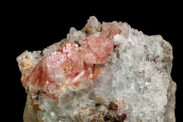 Macro of the mineral stone Rhodochrosite with fluorite on a black background