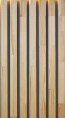 interior decor from wooden vertical stripes with gaps background close-up