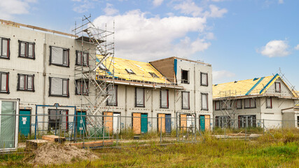 Fototapeta premium Construction of new homes in a new residential area.