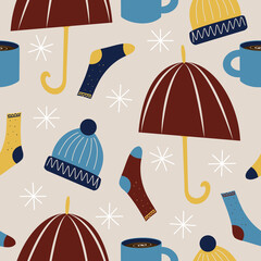 Vector seamless pattern with umbrellas, warm socks, wool hats and hot drinks, seasonal themed