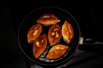 homemade potato pies in a bowl. cooking at home. Traditional Russian food.