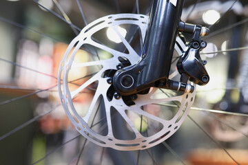 Fototapeta na wymiar Mountain bike front wheel with mechanical disc brake closeup