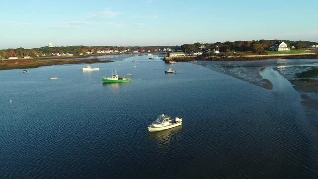 Drone footage over a New England harbor in fall