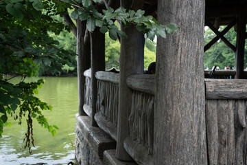 View from behind left side of a park gazebo, overlooking lake. 