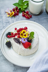 Vegan country cheese dessert with yogurt, berries and red currants.