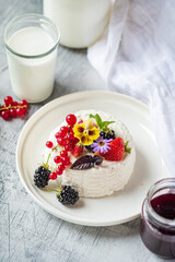 Vegan country cheese dessert with yogurt, berries and red currants.