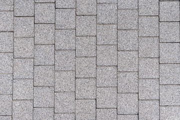 Top view gray square paving slabs, background.