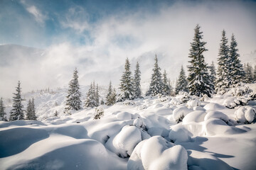 Picturesque view of snow-capped mountains on a frosty day.