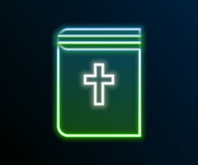 Glowing neon line Holy bible book icon isolated on black background. Colorful outline concept. Vector