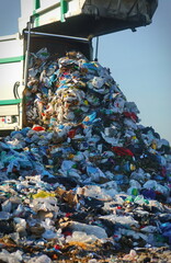 Garbage truck unloading at the dump