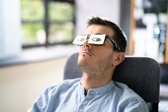 Tired Unhappy Businessperson Sleeping In Office