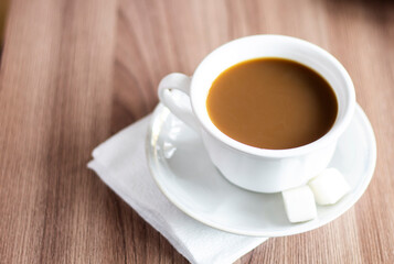 Closeup cup of coffee and sugar on the table office  wooden espresso latte cappuccino beverage aroma breakfast mug morning