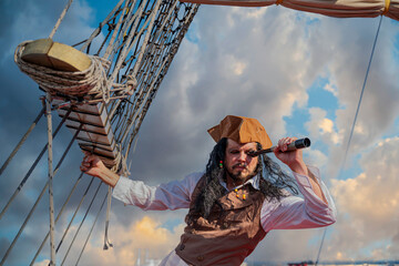 funny pirate captain on a pirate ship - obrazy, fototapety, plakaty