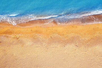 Empty tropical beach, and clear blue water. aerial view.
