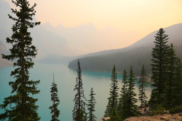 Iconic Moraine Lake in Banff National Park, Alberta, Canada.  Shot during the summer of 2021 it was hazy as a result of smoke from wildfires.