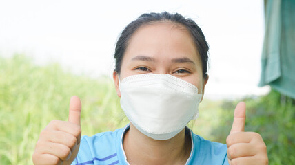 Close-up of Asian woman's face wearing a mask