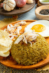 Fried rice is a dish of cooked rice that has been stir-fried in a wok or a frying pan and is usually mixed with other ingredients such as eggs, vegetables, seafood, or meat.