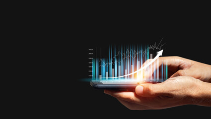 Hand holding smartphone with trading graph. stock exchange marketing analyzing chart. information statistics diagram profit. investment and marketing concept.