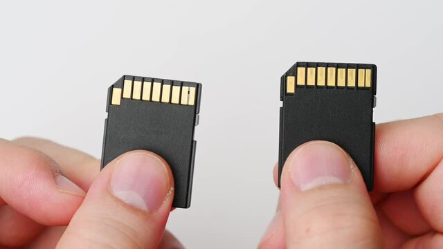 clips video 4k and full HD of memory SD card isolated on clean background this sd card for various computer, digital camera and smart mobile phone devices.