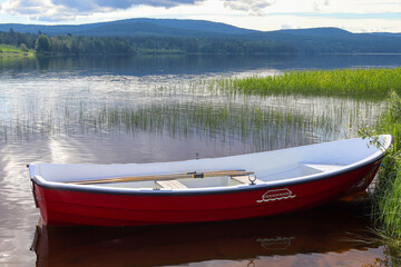 Red lifeboat in the lake