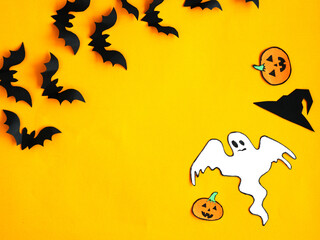 Bats, ghost, pumpkin on an orange background. Smooth layout. Halloween.