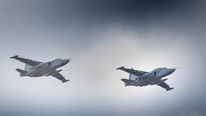 Three military fighter jets as part of a unit in the sky.
