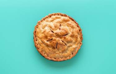 Apple pie above view, isolated on a green background - obrazy, fototapety, plakaty