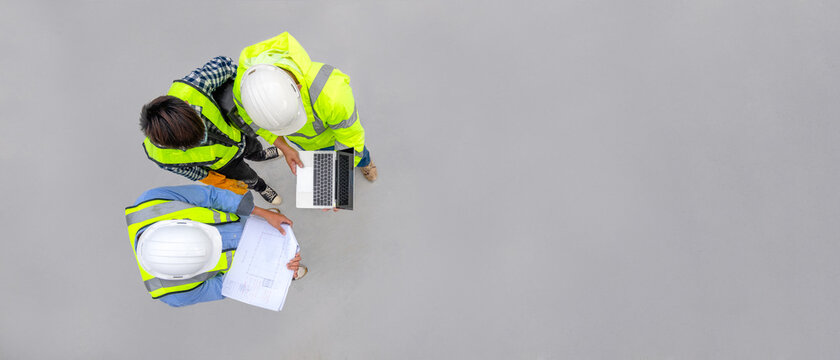 Banner : Civil engineer inspect structure at construction site against blueprint, Building inspector join inspect building structure with civil engineer. Civil engineer hold blueprint inspect building