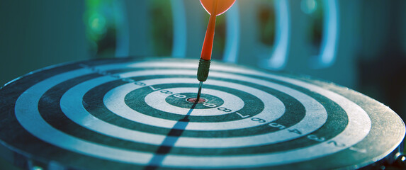 Bullseye or Bulls eye target or dartboard has red dart arrow throw hitting the center of a shooting for financial business targeting planning and aim to winner goal of business concept.