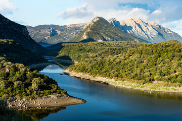Stunning view of the Cedrino Lake (Lago del Cedrino) with the mountain range of Supramonte...