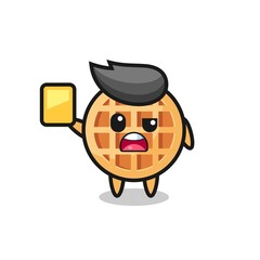 cartoon circle waffle character as a football referee giving a yellow card