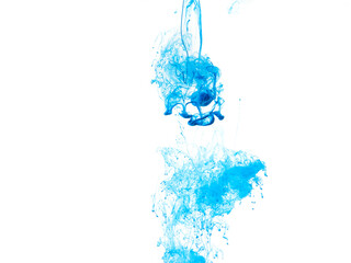 blue paint dissolves in water on a white background, like a cloud or smoke