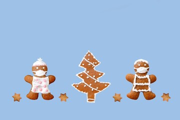 Cute gingerbread couple with protective face masks, christmas tree and stars. Original greeting card in coronavirus (COVID-19) time, isolated on blue background, copy space for text