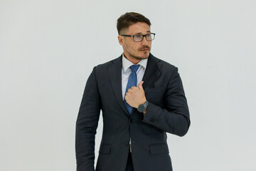 Isolated portrait studio shot of Caucasian masculine handsome smart confident professional successful businessman in formal black suit optical eyeglasses standing look at camera on white background