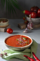 A bowl of Spanish traditional cold tomato and cucumber gazpacho soup
