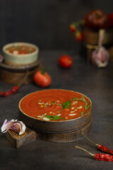 A bowl of Spanish traditional cold tomato and cucumber gazpacho soup