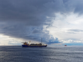 Dark Clouds forming a Storm Front over the Alvheim FPSO in the Norwegian North Sea Sector in early...