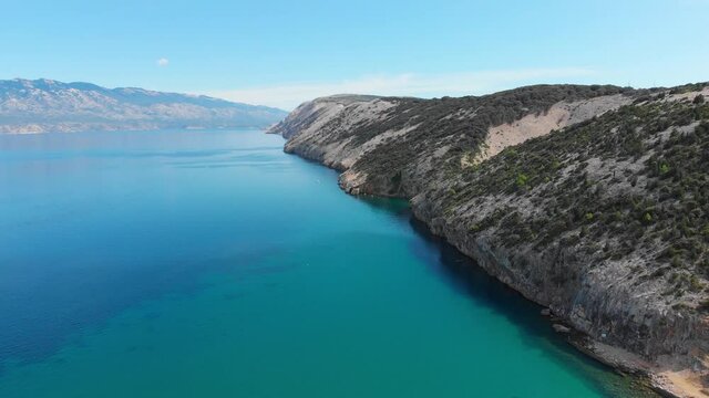Drone footage of Rab Island, Lopar Area in Croatia. Calm, sunny day . Epic landscape, Adriatic blue sea and mountains.