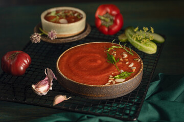A bowl of Spanish traditional cold tomato and cucumber gazpacho soup