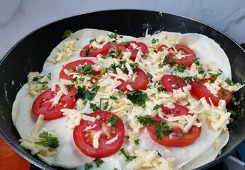 Tortilla Wrap Recipe with tomato slices and grated cheese